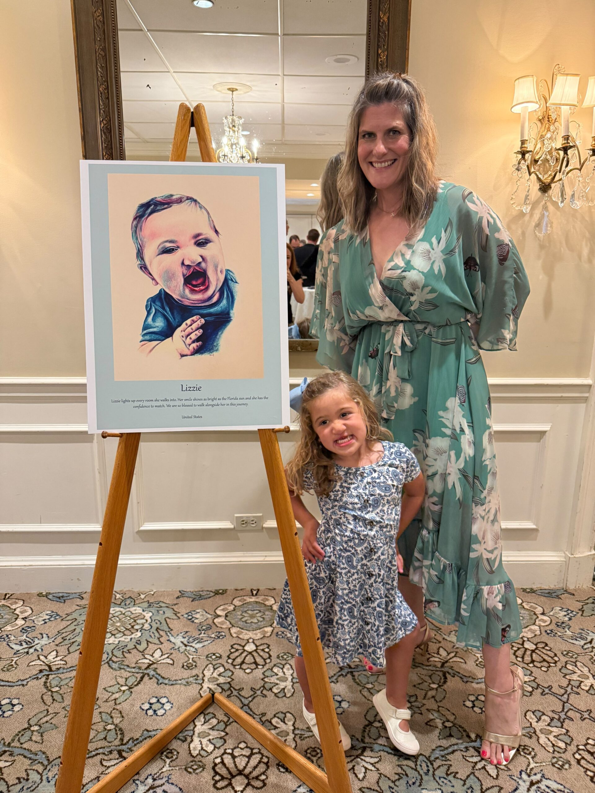 Katie Manning with a portrait at a tour stop
