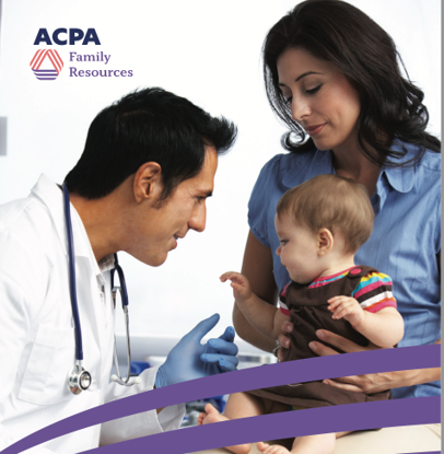 Doctor talking with a parent holding a baby