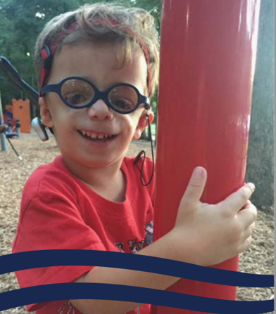 Smiling boy wearing glasses