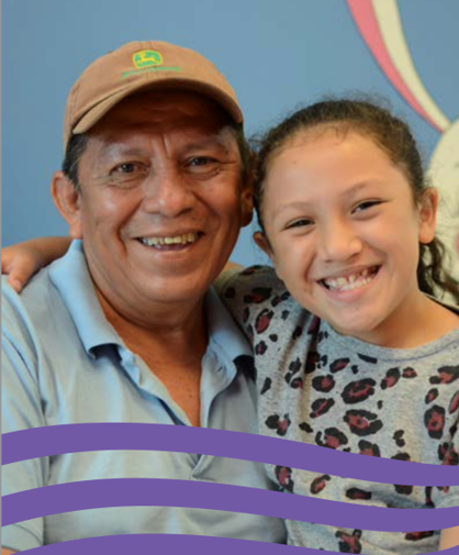 Smiling man and girl