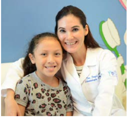 Doctor and a teenage girl smiling